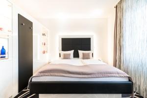
Ein Bett oder Betten in einem Zimmer der Unterkunft Bäder Park Hotel Sieben Welten Therme & Spa Resort
