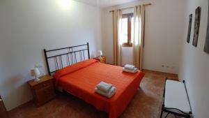 Кровать или кровати в номере Cala Mesquida