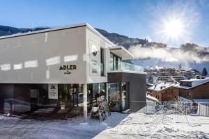 a large building with a ski lift on top of it at Adler Resort in Saalbach-Hinterglemm
