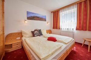 Postel nebo postele na pokoji v ubytování Happy Flachau