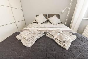 Posteľ alebo postele v izbe v ubytovaní Apartament Wróbelkowo