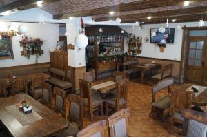 an overhead view of a restaurant with wooden tables and chairs at Panorama Yasinya in Yasinya