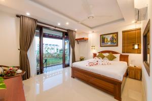 Postel nebo postele na pokoji v ubytování Bonsai Villa Hoi An + 25 fotografií