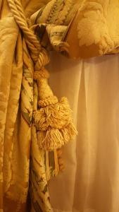 a close up of a curtain with a knot at Casa Pisani Canal in Venice