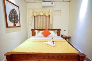 Postel nebo postele na pokoji v ubytování Royal Hotel