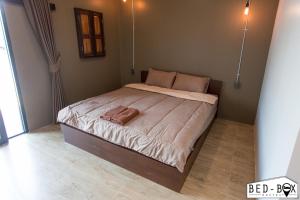 Postel nebo postele na pokoji v ubytování Bed Box