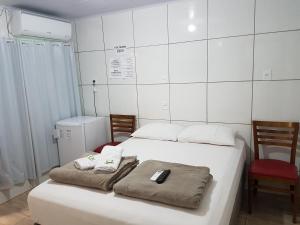 Giường trong phòng chung tại Pousada Do Galdino