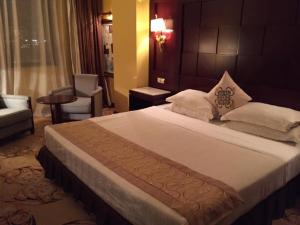 Postel nebo postele na pokoji v ubytování Oasis Hotel