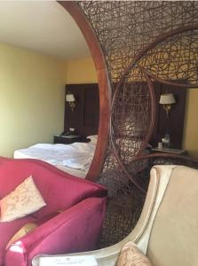 Postel nebo postele na pokoji v ubytování Oasis Hotel