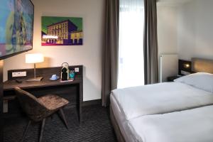 Postel nebo postele na pokoji v ubytování Hotel Südstern