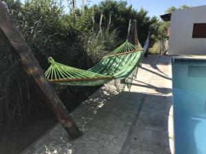 a hammock tied to a fence in a yard at Las Gemelas in Bialet Massé