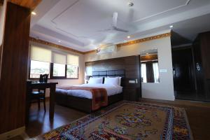 Tempat tidur dalam kamar di Hotel Norbu House