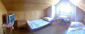 Postel nebo postele na pokoji v ubytování Rekreačný dom Ruža
