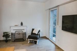 TV a/nebo společenská místnost v ubytování Ferienhaus Schneeweiß