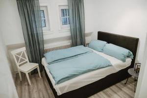 Säng eller sängar i ett rum på Ferienhaus Schneeweiß
