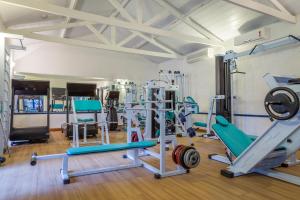 a gym with several treadmills and machines at Pousada da Condessa in Paraty