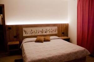Cama o camas de una habitación en Hotel Beau Sejour