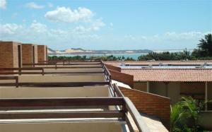 a group of benches on top of a building at CostaSol Pipa Chalés in Pipa