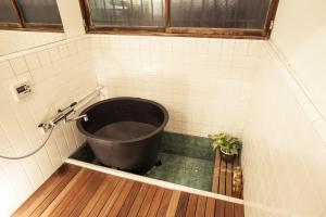 a bath tub in a bathroom with a window at Minato-ku - House / Vacation STAY 12127 in Tokyo