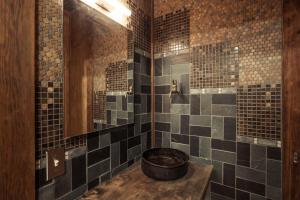 a bathroom with a tub in a room with tiles at Minato-ku - House / Vacation STAY 12127 in Tokyo