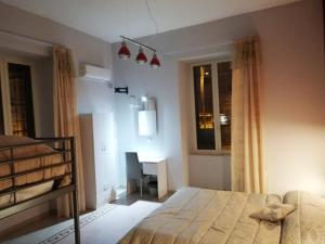 Postel nebo postele na pokoji v ubytování B&B Enjoy Ercolano