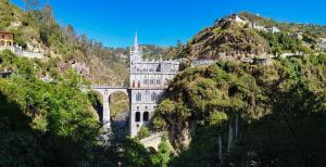 a castle on the side of a mountain at Hotel Casa de Peregrinos in Ipiales