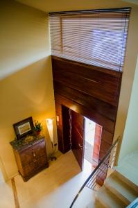an attic room with a staircase and a window at B&B Tina de Pacs, close to local wineries in Pacs del Penedes