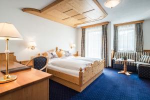 Posteľ alebo postele v izbe v ubytovaní Alpenhotel Plaza