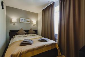 En eller flere senger på et rom på Mini Hotel Rooms & Breakfast