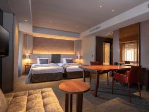 Tempat tidur dalam kamar di Tokyu Stay Kyoto Sakaiza Shijo Kawaramachi