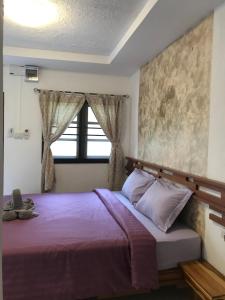 Postel nebo postele na pokoji v ubytování Green guesthouse kohchang