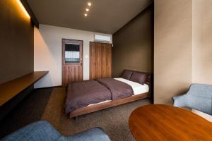 Un pat sau paturi într-o cameră la D-style RYCOM