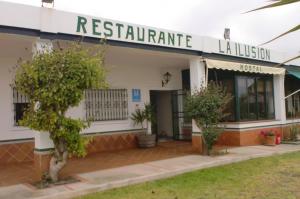a building with a sign that reads restaurant laeus at Hostal Restaurante La Ilusion in El Palmar