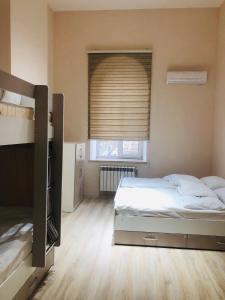 Postel nebo postele na pokoji v ubytování Travel Inn Hostel