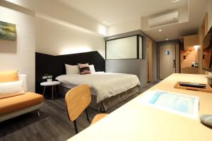 Postel nebo postele na pokoji v ubytování Hai Sheng Wei B&B