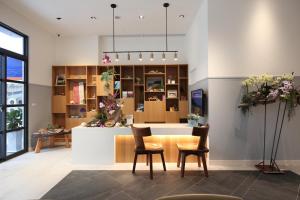 a dining room with a table and two chairs at Hai Sheng Wei B&B in Dahan