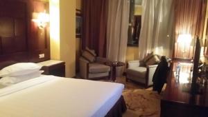 Postel nebo postele na pokoji v ubytování Oasis Hotel