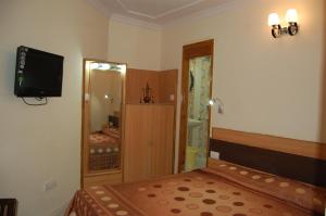 Postel nebo postele na pokoji v ubytování Hotel Prestige