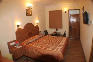 Postel nebo postele na pokoji v ubytování Hotel Prestige