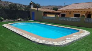 Bazén v ubytování Cortijo Rural Los Gonzalez nebo v jeho okolí