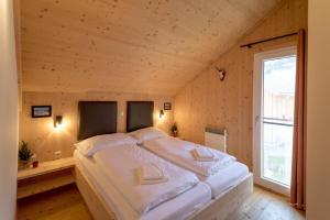 Postel nebo postele na pokoji v ubytování Luxury Chalet Kreischberg 11a