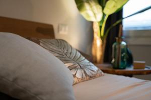 A bed or beds in a room at OFFICINE CAVOUR Piazza Cavour