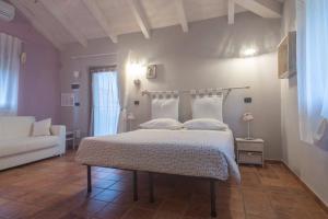 Ένα ή περισσότερα κρεβάτια σε δωμάτιο στο Agriturismo Terra e Cielo