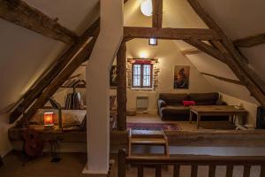 a living room with a couch and a table at Les Tramois in Donzy