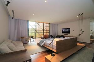 TV a/nebo společenská místnost v ubytování Felissimo Exclusive Hotel