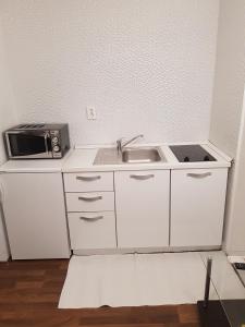 Kuchyň nebo kuchyňský kout v ubytování Apartments Minerva