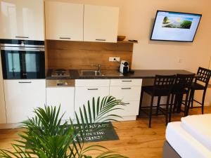 A kitchen or kitchenette at Sonnenweg Appartements