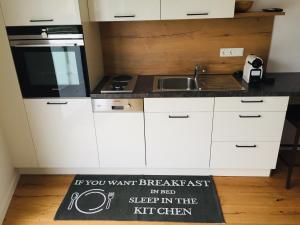 A kitchen or kitchenette at Sonnenweg Appartements