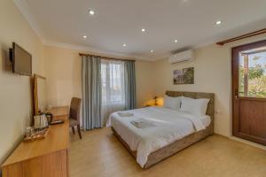 Katil atau katil-katil dalam bilik di Anatolia Hotel Geyre Karacasu Aydın (Aphrodisias)