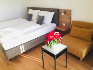 A bed or beds in a room at Sonnenweg Appartements